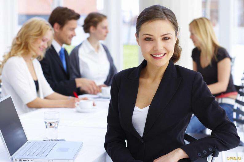 1259356707_business-woman-table-group.jpg