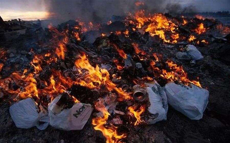Open trash burning, the garbage contains plastics which when burnt release dangerous dioxins, Churchill, Canada