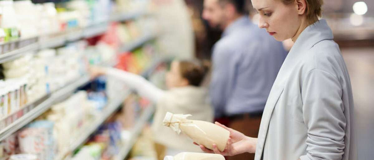 Woman Choosing Good Milk