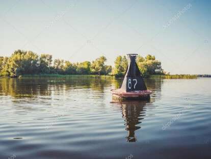 depositphotos_81833028-stock-photo-river-buoy-amid-the-calm