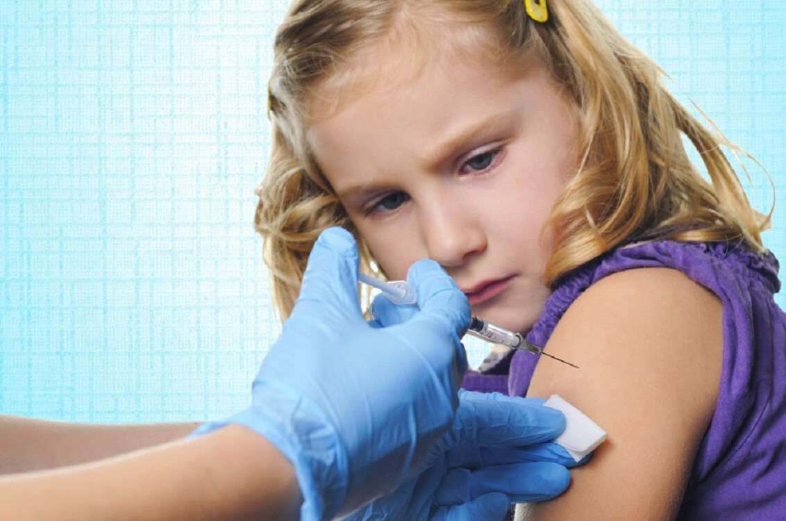 Child vaccinations on blue background.