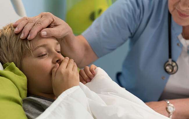 33346382 - close-up of coughing toddler lying in hospital bed