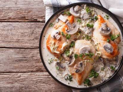 Chicken breast with mushrooms in cream sauce horizontal top view