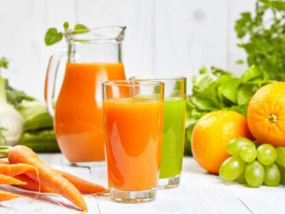 carrot juice on white wood  background