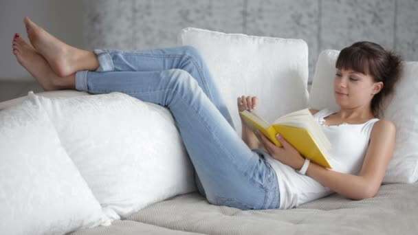 depositphotos_79784556-stock-video-woman-relaxing-on-sofa-reading