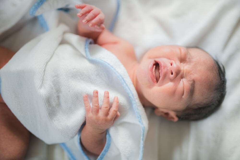 Asian new born baby sleep with crying