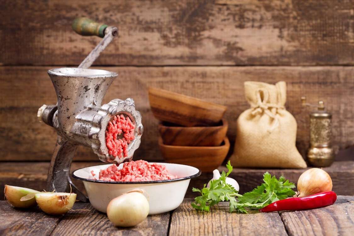 old grinder with minced meat