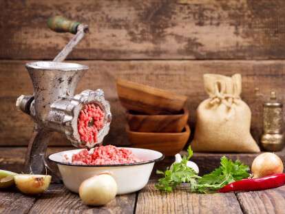 old grinder with minced meat