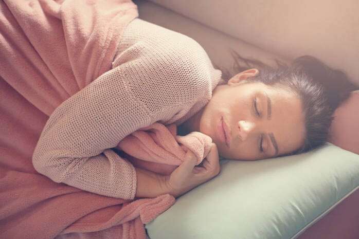 Woman resting on the couch.