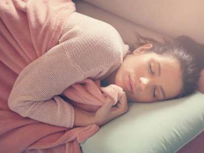 Woman resting on the couch.
