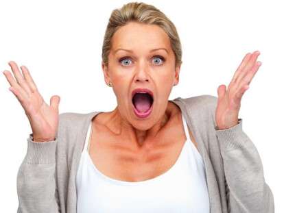 Surprised woman isolated against white background
