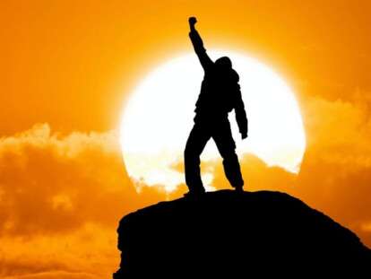 Man on top of mountain