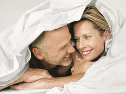 Couple wrapped in a duvet