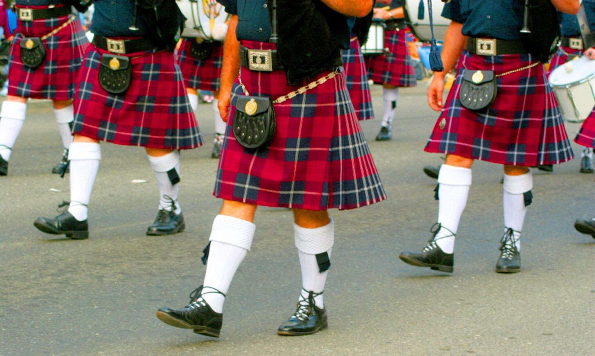 close-up-of-scottish-kilts-of-a-marching-bagpipe-band-wp