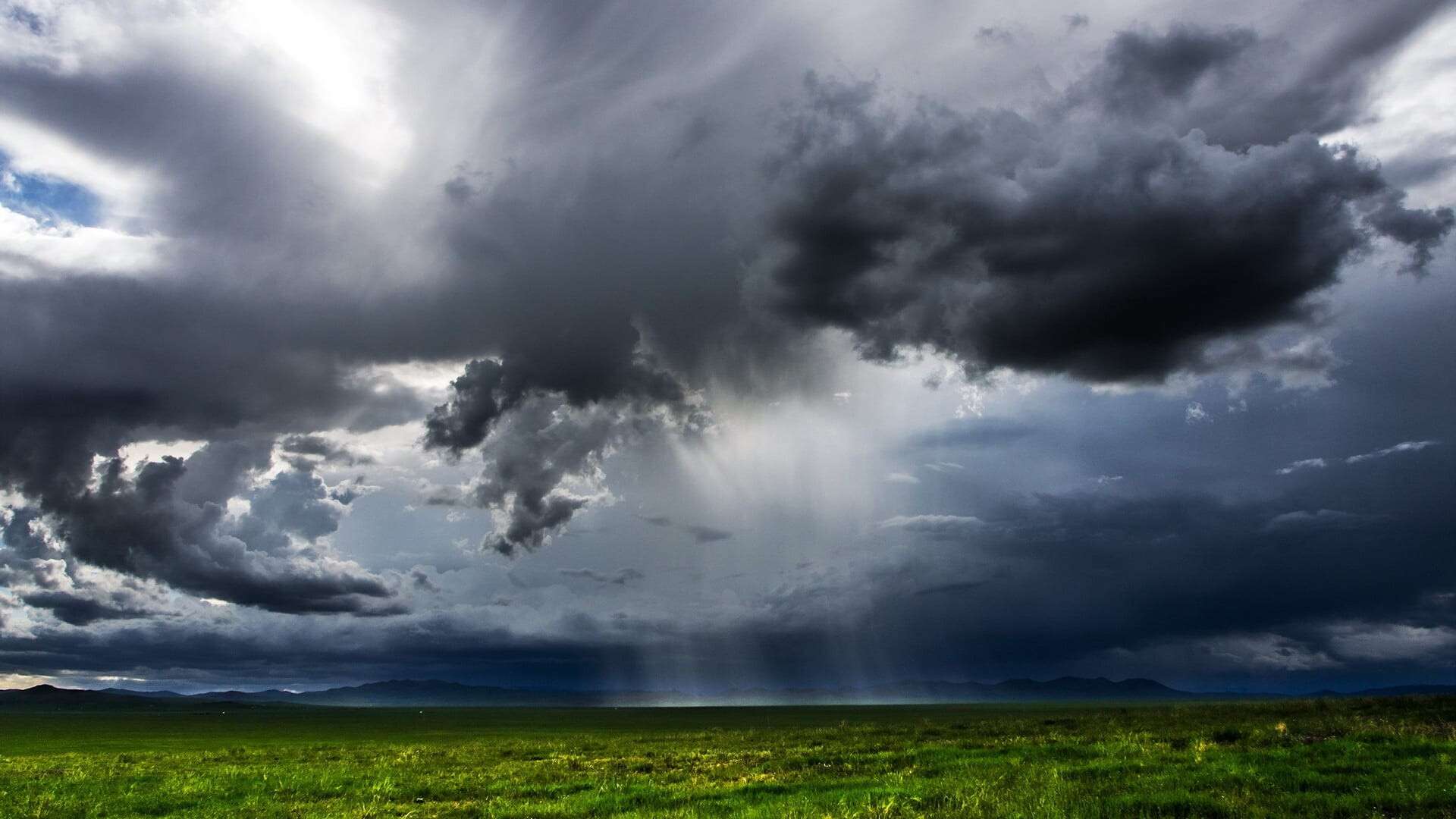 mongolia-green-fields-dark-clouds-rain_1920x1080