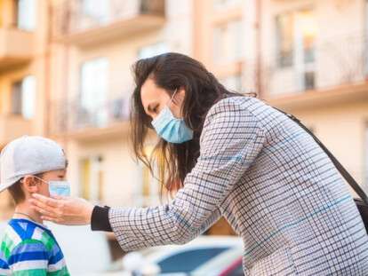 medical-mask-to-prevent-coronavirus-coronavirus-quarantine-mother-puts-a-safety-mask-on-her-son-s-face-schoolboy-is-ready-go-to-school_293990-310